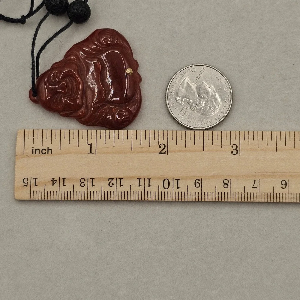 Carved Red Stone Laughing Buddha Pendant Black Cord Necklace Gold Tone Accent